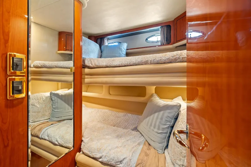 Slide: The Image of Luxurious cabin interior of 2001 Sea Ray 540 Cockpit Motor Yacht with cozy bedding. - 34