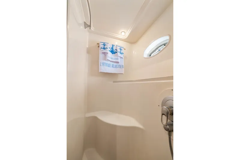 Slide: The Image of Shower area in 2001 Sea Ray 540 Cockpit Motor Yacht with towel and porthole. - 38