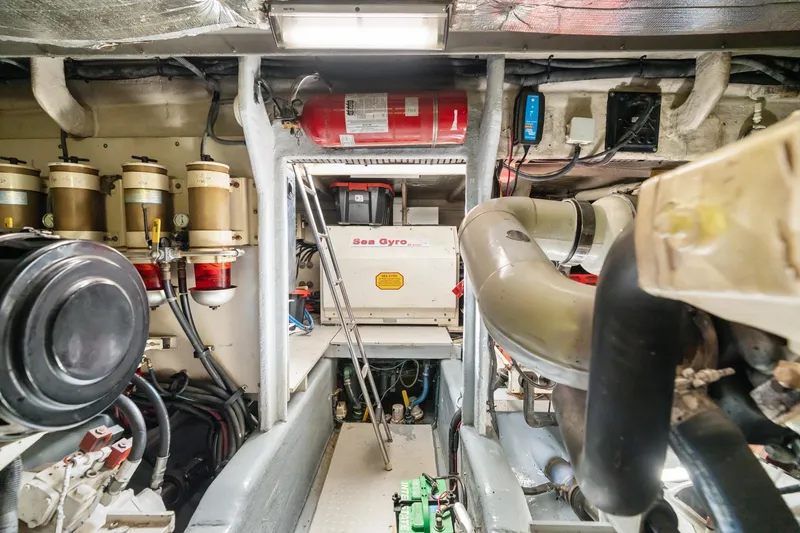 Slide: The Image of Engine room of 2001 Sea Ray 540 Cockpit Motor Yacht with mechanical equipment. - 40
