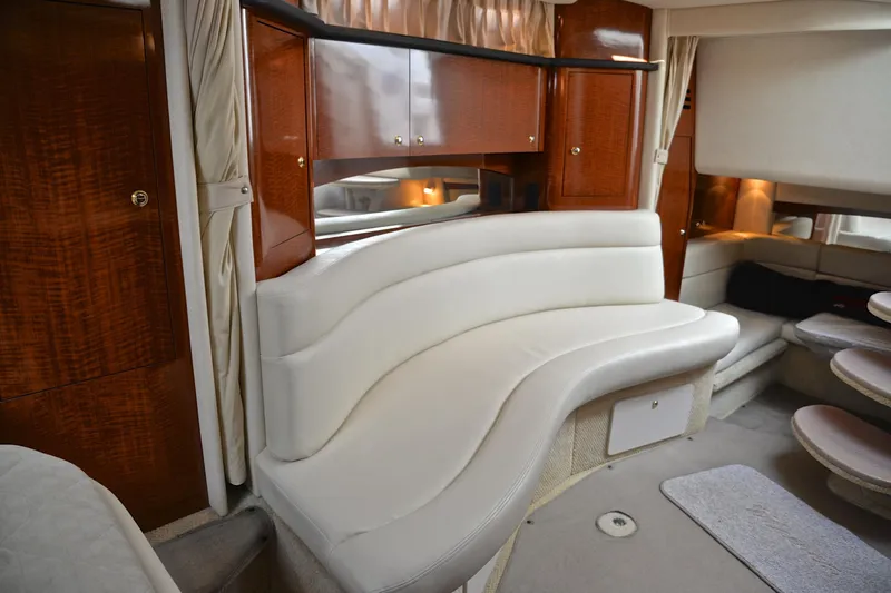 Slide: The Image of Luxurious interior of 2003 Sea Ray 320 Sundancer yacht with elegant seating and wood cabinetry. - 37