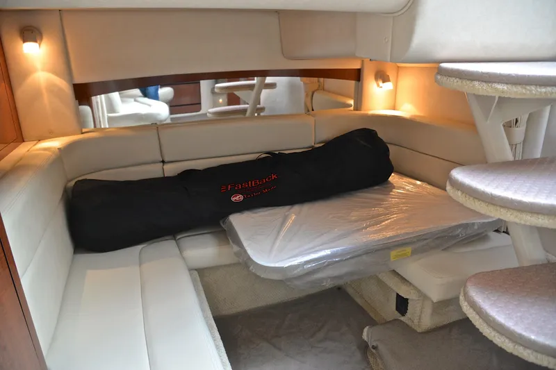 Slide: The Image of Interior cabin of 2003 Sea Ray 320 Sundancer with seating and table. - 41