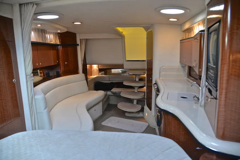 Slide: The Image of Luxurious interior of 2003 Sea Ray 320 Sundancer yacht with elegant seating and modern amenities. - 42