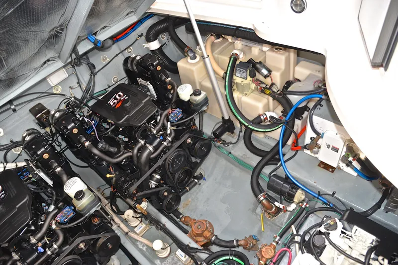 Slide: The Image of Engine room of 2003 Sea Ray 320 Sundancer with dual 5.0L engines and wiring. - 46