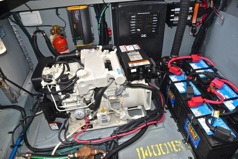 Slide: The Image of Engine room of 2003 Sea Ray 320 Sundancer with Kohler generator and batteries. - 47