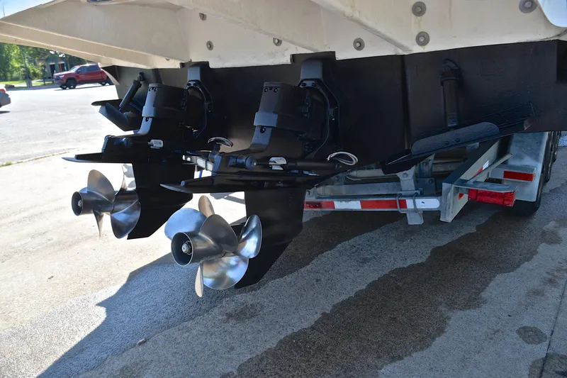 Slide: The Image of Rear view of 2003 Sea Ray 320 Sundancer boat propellers on a trailer. - 48