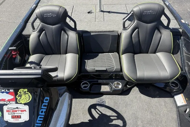 Slide: The Image of 2024 Skeeter ZXR20 boat interior with two black seats and console details. - 20