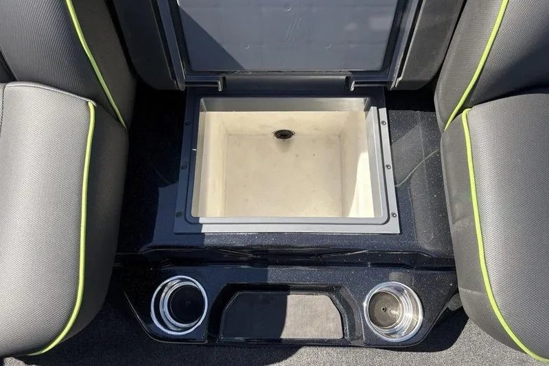 Slide: The Image of 2024 Skeeter ZXR20 boat interior with storage compartment and cup holders. - 21