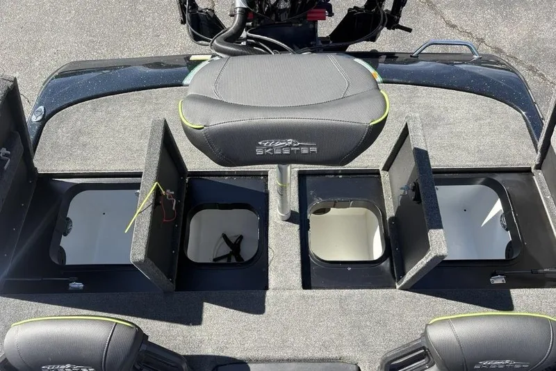 Slide: The Image of 2024 Skeeter ZXR20 boat deck with open storage compartments and seating. - 22
