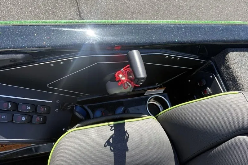 Slide: The Image of 2024 Skeeter ZXR20 boat dashboard with control panel and seating. - 23