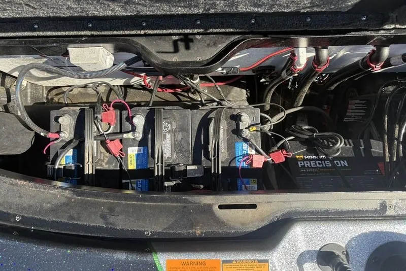 Slide: The Image of Battery compartment of a 2024 Skeeter ZXR20 boat with wiring and connections. - 28