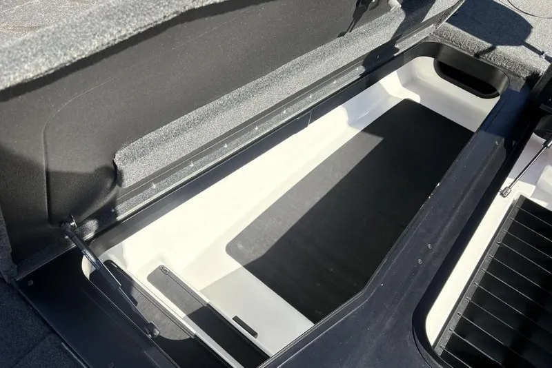 Slide: The Image of 2024 Skeeter ZXR20 boat storage compartment, open and empty, showcasing interior space. - 4