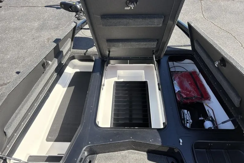 Slide: The Image of 2024 Skeeter ZXR20 boat storage compartments with open lids, showcasing interior space. - 9