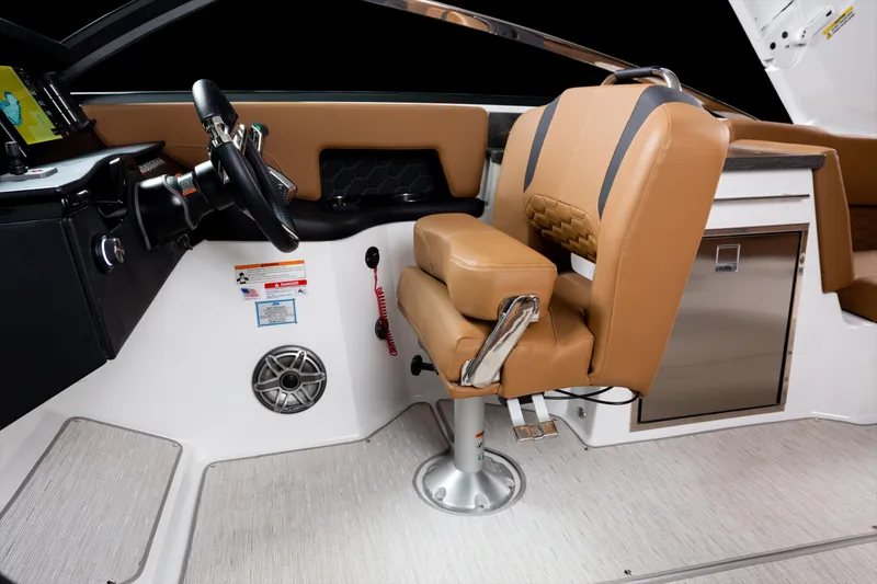 Slide: The Image of 2026 Four Winns H9 OB boat interior with tan seating and modern dashboard. - 16