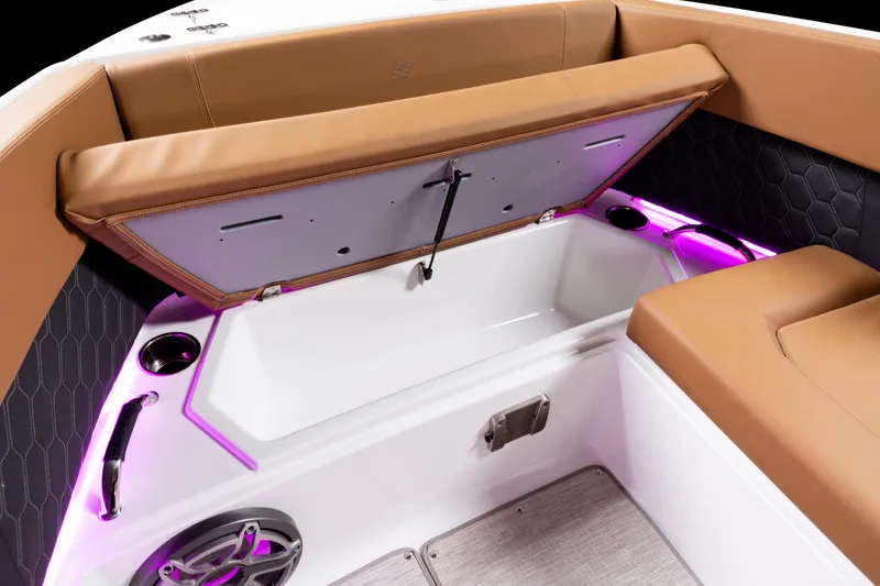 Slide: The Image of 2026 Four Winns H9 OB boat interior with open storage compartment and ambient lighting. - 22