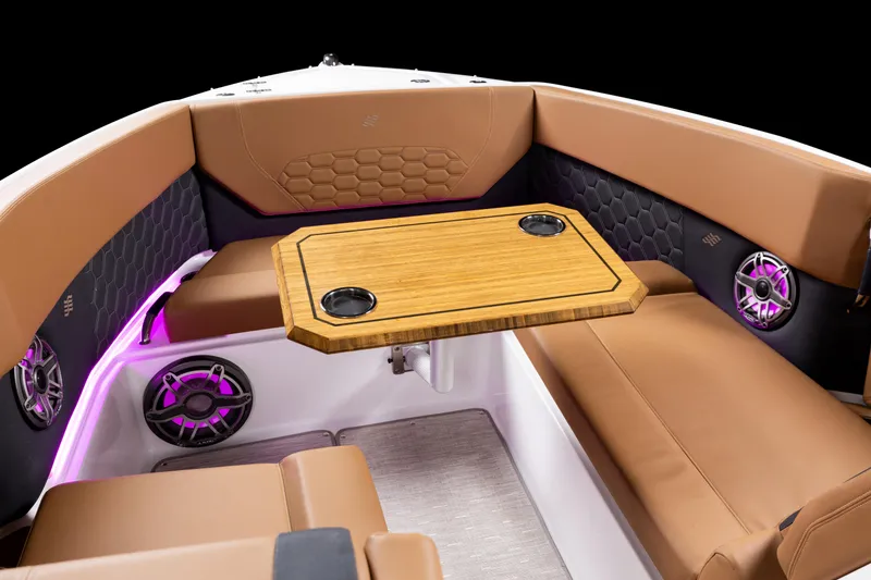 Slide: The Image of Luxurious interior of 2026 Four Winns H9 OB boat with elegant seating and ambient lighting. - 23