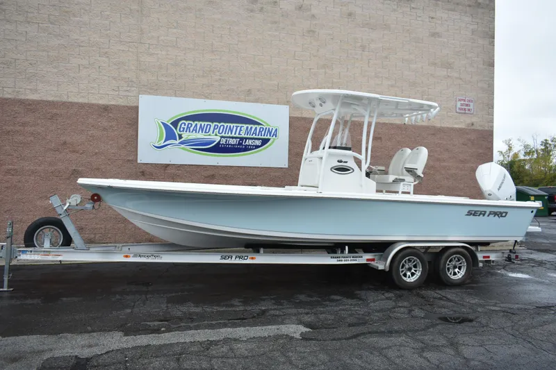 Slide: The Image of 2025 Sea Pro 250 Bay boat on trailer at Grand Pointe Marina. - 1