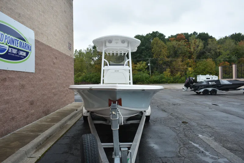 Slide: The Image of 2025 Sea Pro 250 Bay boat on trailer at marina parking lot. - 2