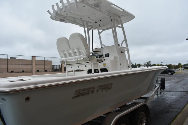 Slide: The Image of 2025 Sea Pro 250 Bay boat on trailer, overcast day background. - 4