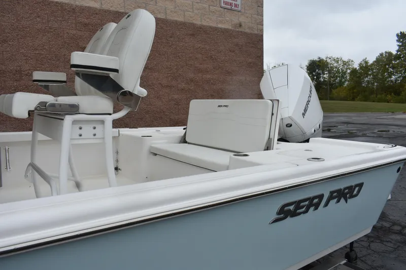 Slide: The Image of 2025 Sea Pro 250 Bay boat with white seating and Mercury engine. - 9