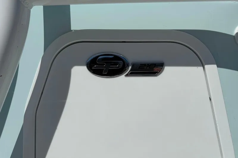 Slide: The Image of 2026 Sea Pro 210 Bay boat emblem on a white surface. - 8