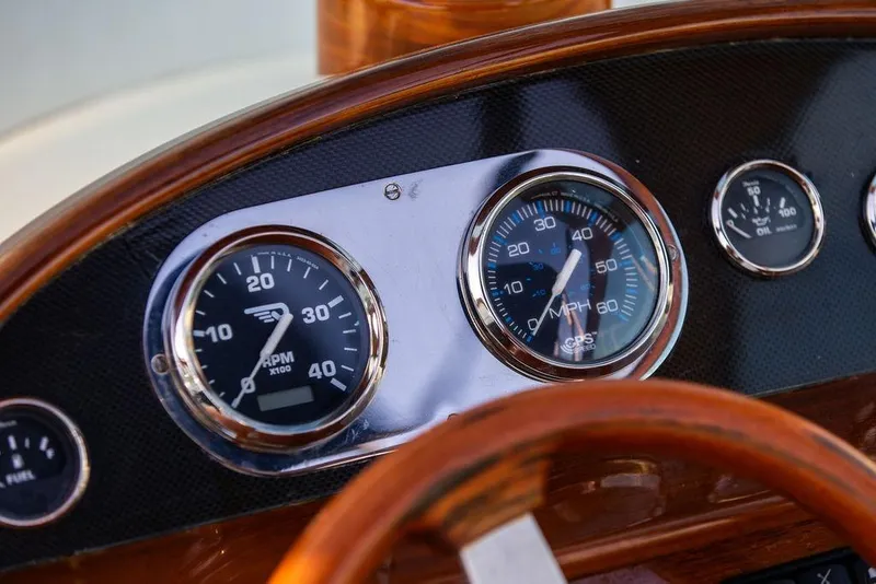 Slide: The Image of Dashboard of 2005 Hinckley Talaria 29R with RPM and speed gauges. - 19