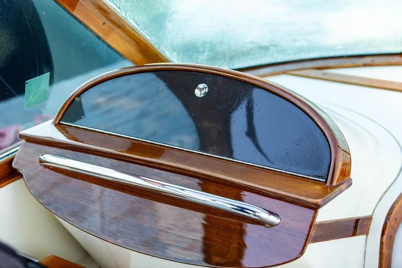 Slide: The Image of Hinckley Talaria 29R 2005 dashboard with elegant wood and chrome detailing. - 18