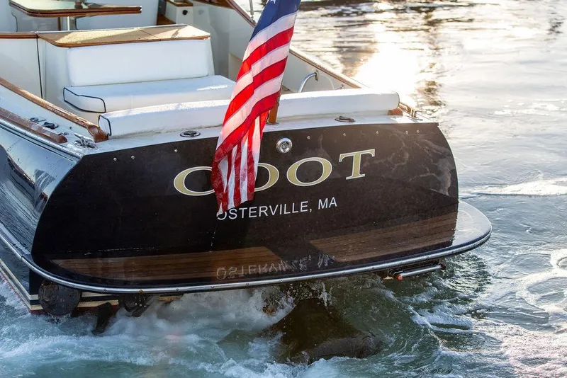 Slide: The Image of Hinckley Talaria 29R 2005 boat with American flag, Osterville, MA. - 9