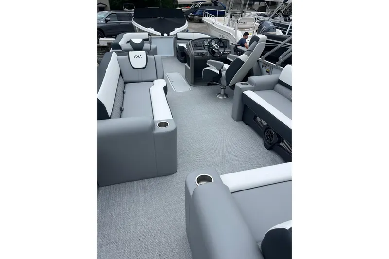 Slide: The Image of 2026 Avalon 25 LSZ ELITE pontoon boat interior with gray seating and modern dashboard. - 4