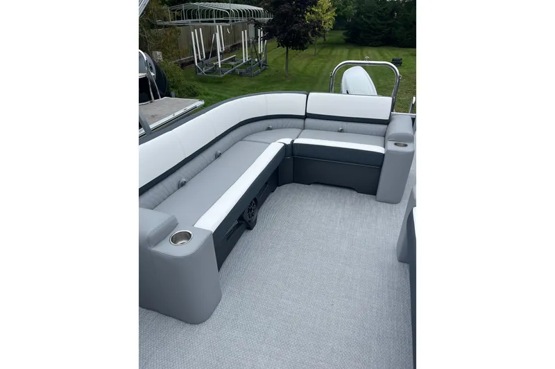 Slide: The Image of Luxurious seating on 2026 Avalon 25 LSZ Elite pontoon boat, featuring sleek gray and white upholstery. - 6