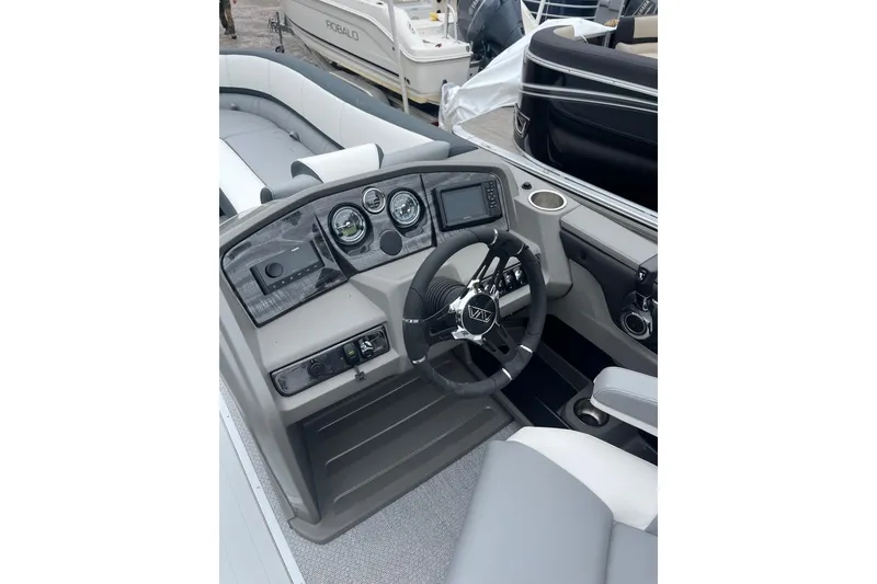 Slide: The Image of Cockpit of 2026 Avalon 25 LSZ Elite pontoon boat with modern steering and controls. - 8
