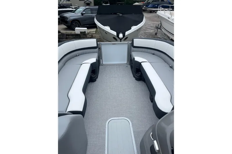 Slide: The Image of 2026 Avalon 25 LSZ ELITE pontoon boat interior with gray and white seating. - 9