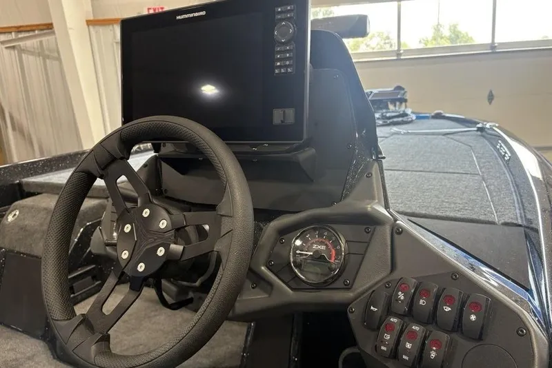 Slide: The Image of Steering console of 2026 Skeeter ZXE20 boat with digital display and control panel. - 19