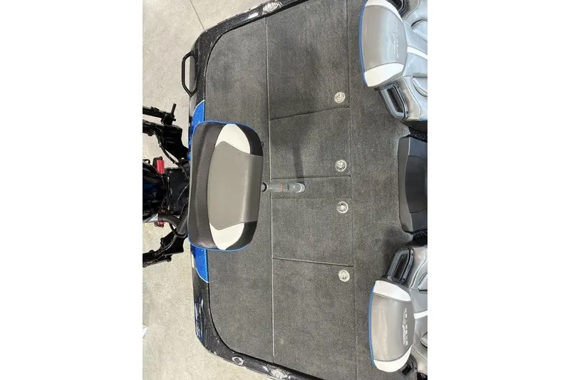 Slide: The Image of 2026 Skeeter ZXE20 boat interior with gray carpet and seating arrangement. - 20