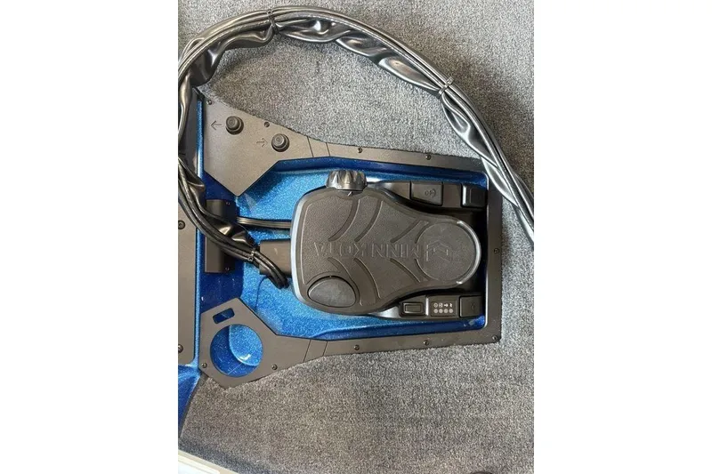Slide: The Image of Foot pedal control system in a 2026 Skeeter ZXE20 boat, featuring sleek design and wiring. - 6
