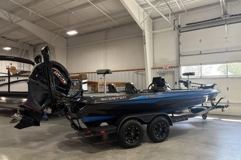 Slide: The Image of 2026 Skeeter ZXE20 boat in showroom, featuring sleek design and powerful engine. - 7