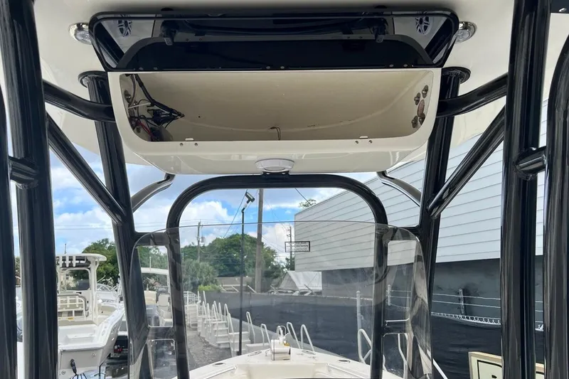 Slide: The Image of 2026 Key West 239 FS boat interior with T-top and console view. - 22