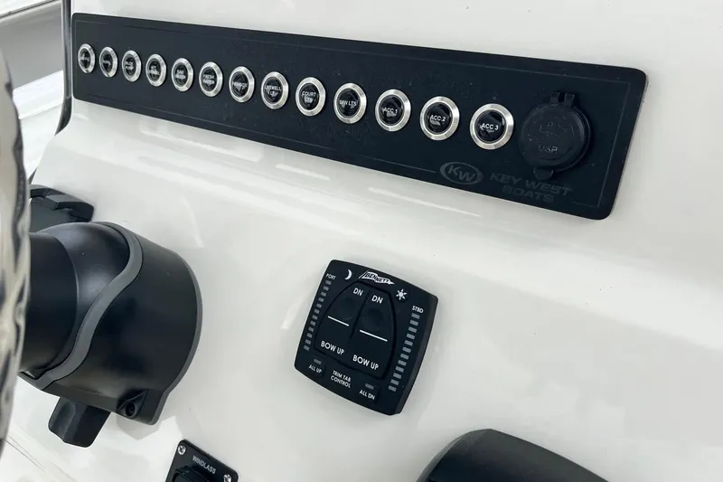 Slide: The Image of Control panel of 2026 Key West 239 FS boat with switches and USB port. - 27