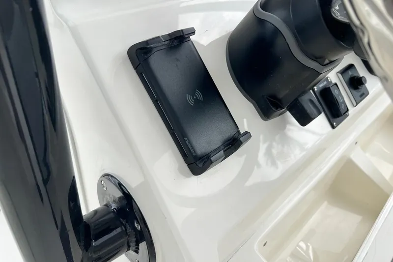 Slide: The Image of Control panel of 2026 Key West 239 FS boat with wireless charging pad. - 28