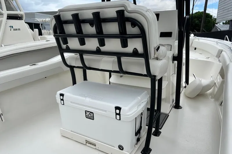 Slide: The Image of 2026 Key West 239 FS boat interior with seating and cooler storage. - 31
