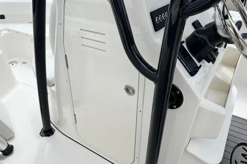Slide: The Image of 2026 Key West 239 FS boat interior with steering wheel and control panel. - 33
