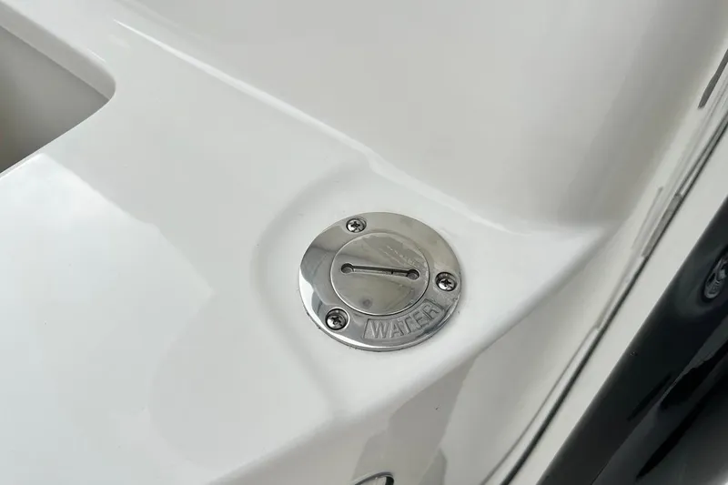 Slide: The Image of 2026 Key West 239 FS boat water fill cap on white deck surface. - 36