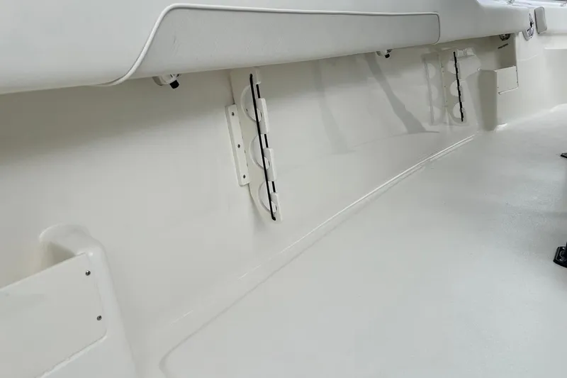 Slide: The Image of 2026 Key West 239 FS boat interior, showcasing sleek white design and storage features. - 39