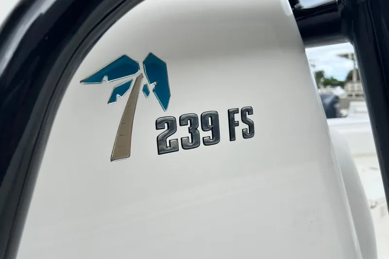 Slide: The Image of Key West 239 FS 2026 boat logo on white surface. - 42