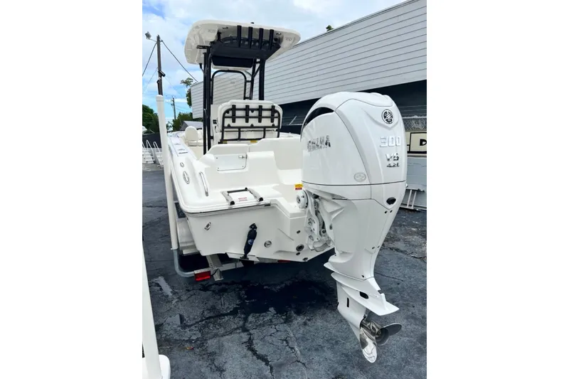 Slide: The Image of 2026 Key West 239 FS boat with Yamaha 300 V6 engine, parked outdoors. - 7
