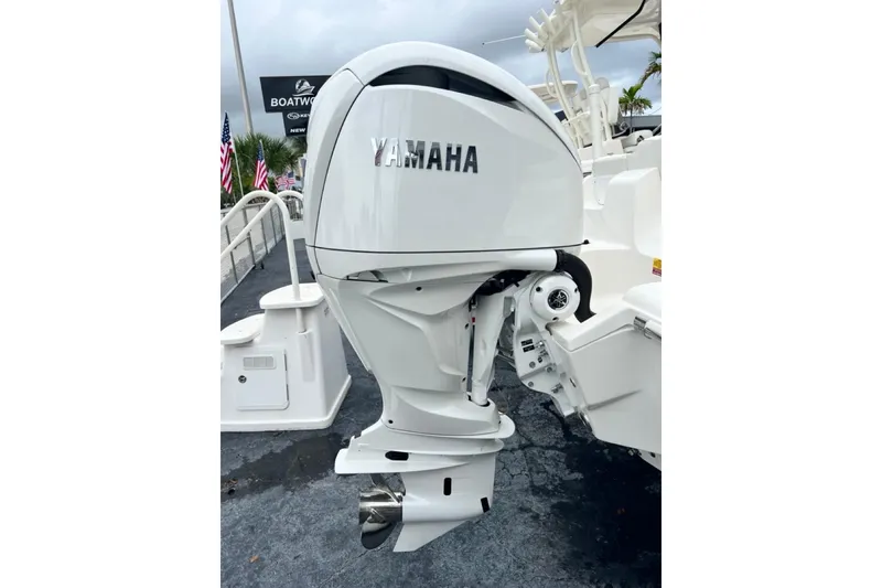 Slide: The Image of 2026 Key West 239 FS boat with Yamaha outboard motor, displayed at a dealership. - 9