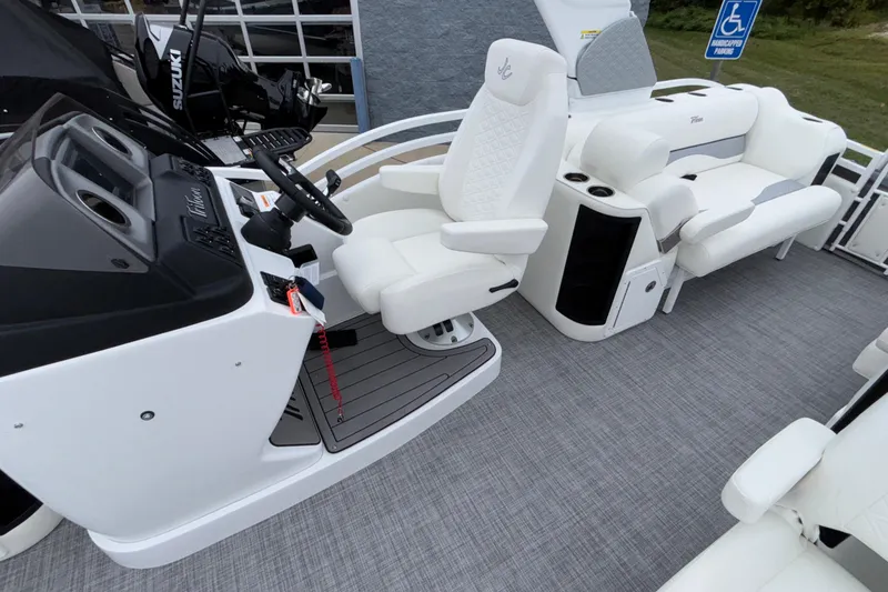 Slide: The Image of 2026 JC NEPTOON 27TT SPORT boat interior with white seating and modern dashboard. - 11