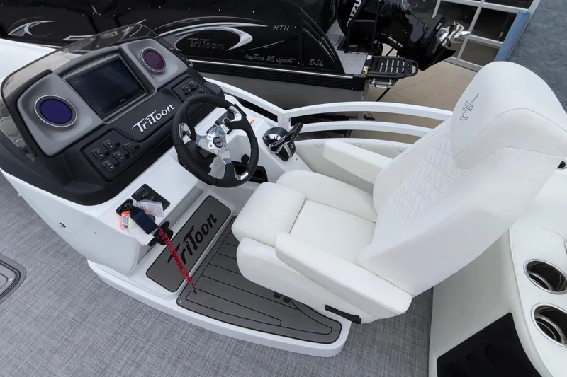 Slide: The Image of Cockpit of 2026 JC NEPTOON 27TT SPORT boat with steering wheel and white captain's chair. - 12