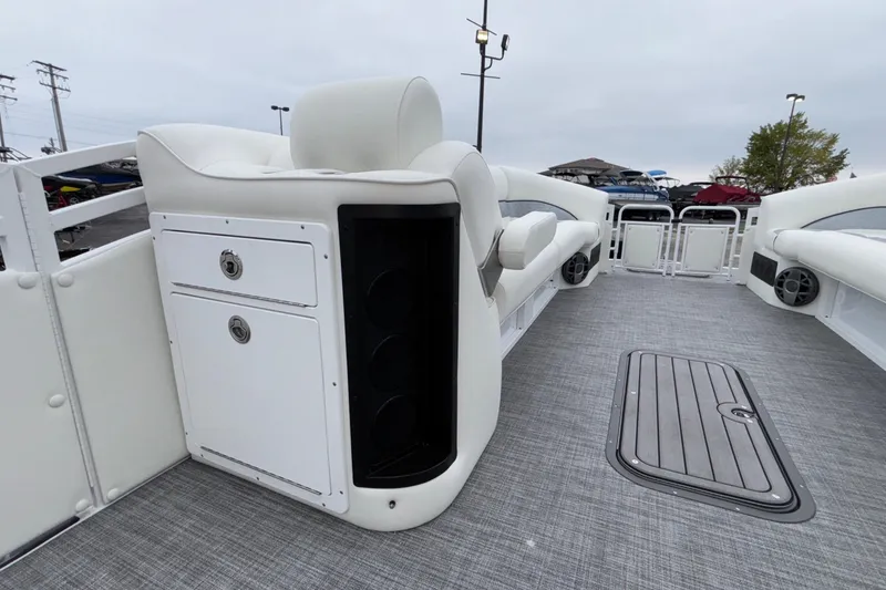 Slide: The Image of 2026 JC NEPTOON 27TT SPORT boat interior with white seating and gray flooring. - 16