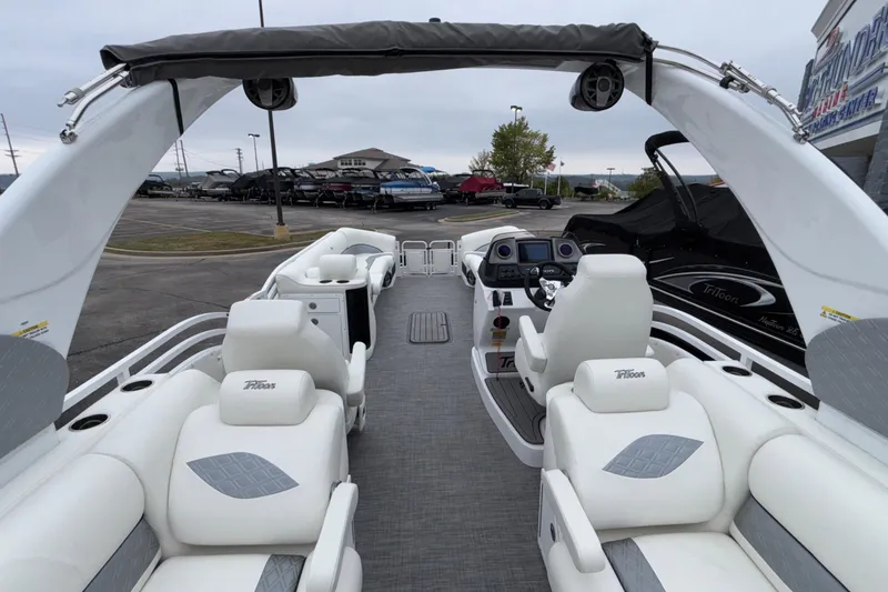 Slide: The Image of 2026 JC NEPTOON 27TT SPORT boat interior with white seating and modern dashboard. - 23