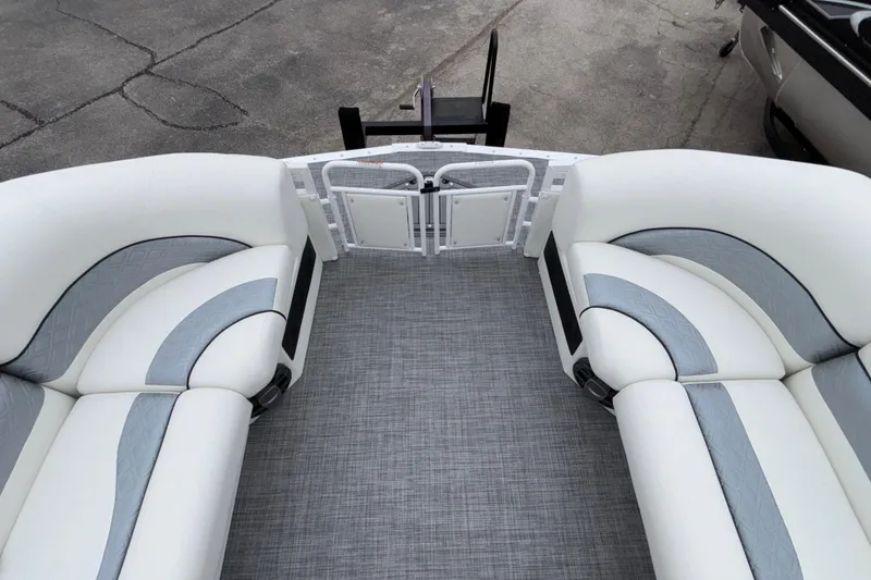 Slide: The Image of 2026 JC NEPTOON 27TT SPORT boat interior with white and gray seating. - 7
